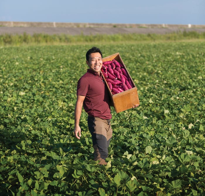 Toshishige Fujiwara shows off his prize Naruto kintoki sweet potatoes